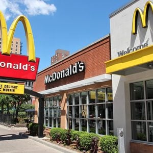 CHICAGO, USA - JUNE 28, 2013: People walk by McDonald's restaurant in Chicago. McDonald's is the 2nd most successful restaurant franchise in the world with 33,000 locations.; Shutterstock ID 586000214