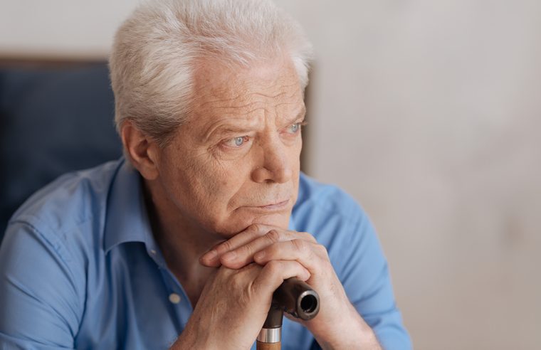 Portrait of a sad senior man thinking about his past