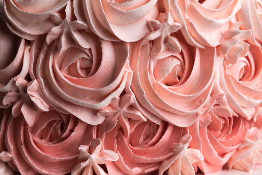 Rose cake icing swirl decoration background pattern. Horizontal.