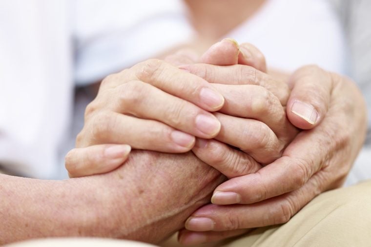 close-up of hands of a senior couple held together, concept for love, help, comforting and consoling