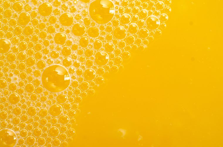 Orange juice bubbles macro texture health fresh