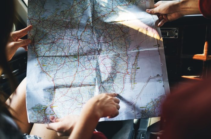 Friends Reading Map Traveling Destination Camping Concept