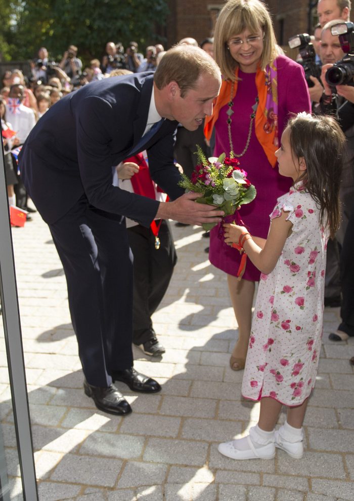 Prince William receiving flowers