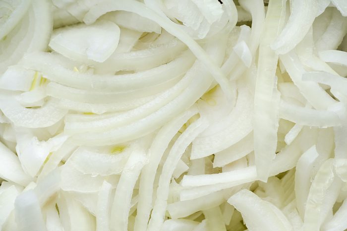 Fresh sliced onions. Background texture. Close-up.