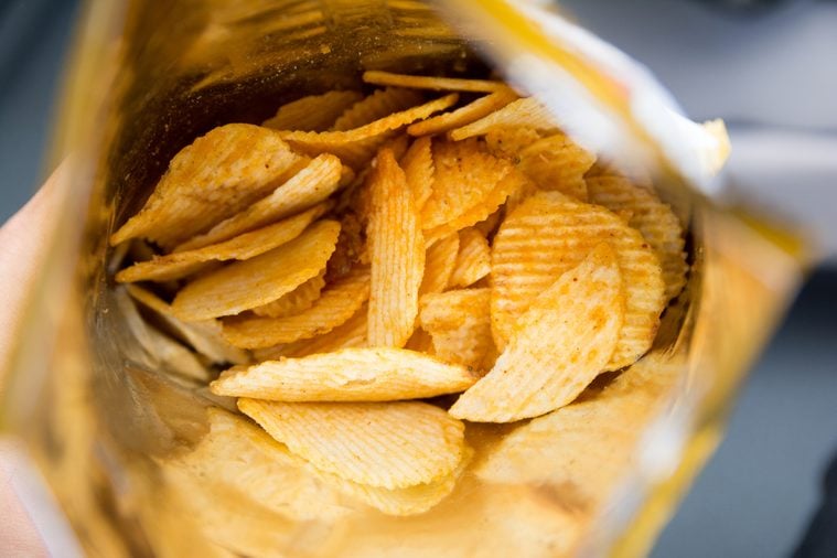 Potato chips is snack in bag ready to eat and fat food or junk food., Potato Chips in a Ready-to-Eat Bag.