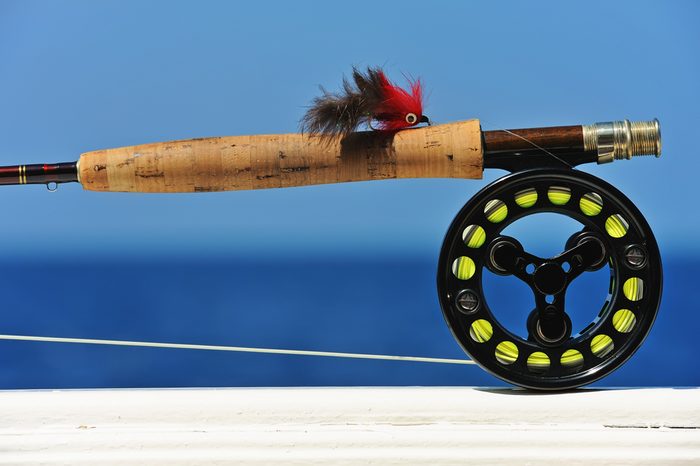 Close up shot of saltwater fly fishing tackle against sea