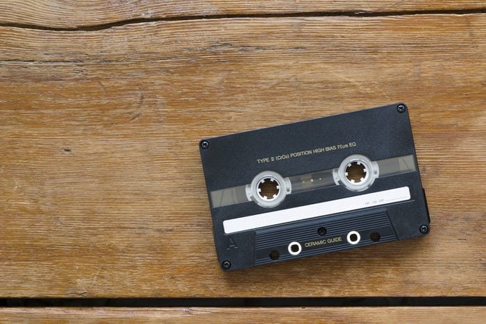vintage hi-end audio cassette on cracked wooden table