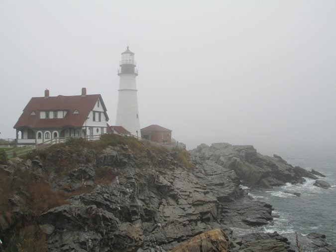 Maine lighthouse on a foggy morning