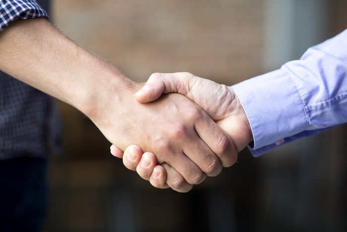 Closeup of Two Business Men Shaking Hands