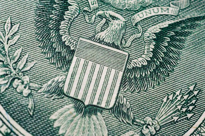  US one (1 ) dollar bill in a macro shot, super macro, close up photo. Shallow depth of field effect. Great Seal of the United States Logo.