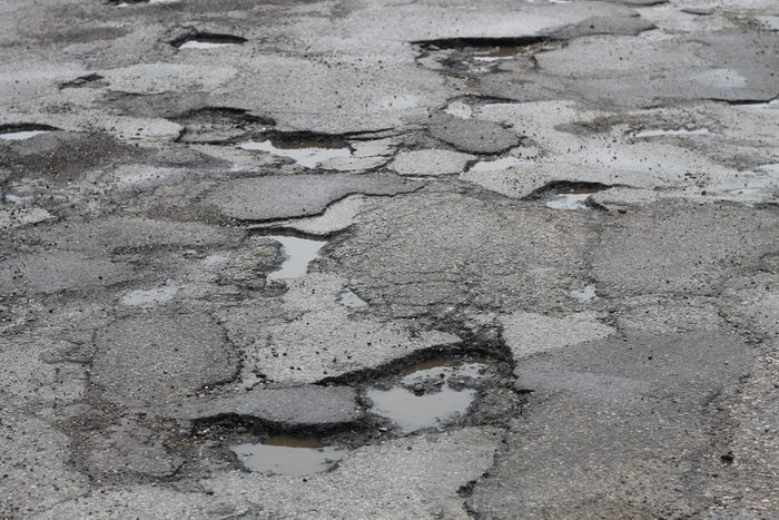 deep potholes in the road make driving hazardous