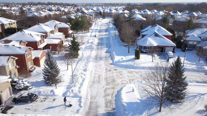 Aerial drone image of suburban houses after a snow storm during Christmas in Oakville, Ontario.