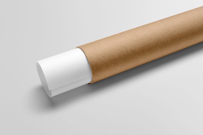Paper tube mockup scene, blank objects for placing your design. Cardboard paper tube with papers.