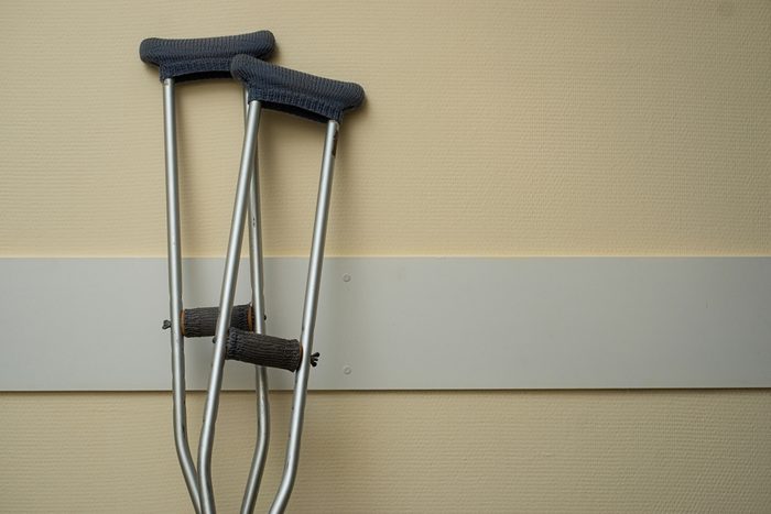 Crutches stand near the wall in the hospital