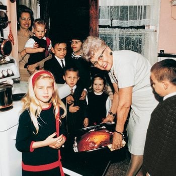Family cooking turkey.