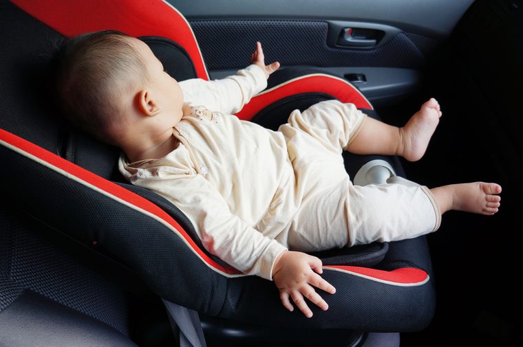 cute baby sleep in the baby car seat at the front car seat