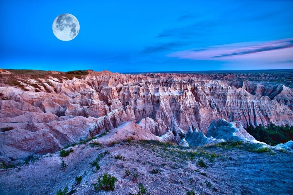 Badlands Dusk (HDR) with Full Moon on the Sky. Beautiful Scenic Photography. Badlands National Park, U.S.A.