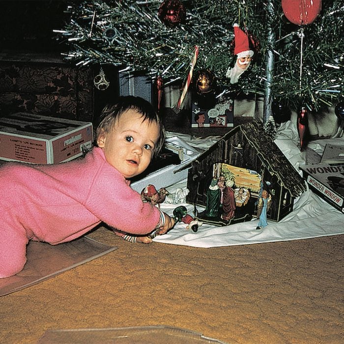 Baby calling below the Christmas tree