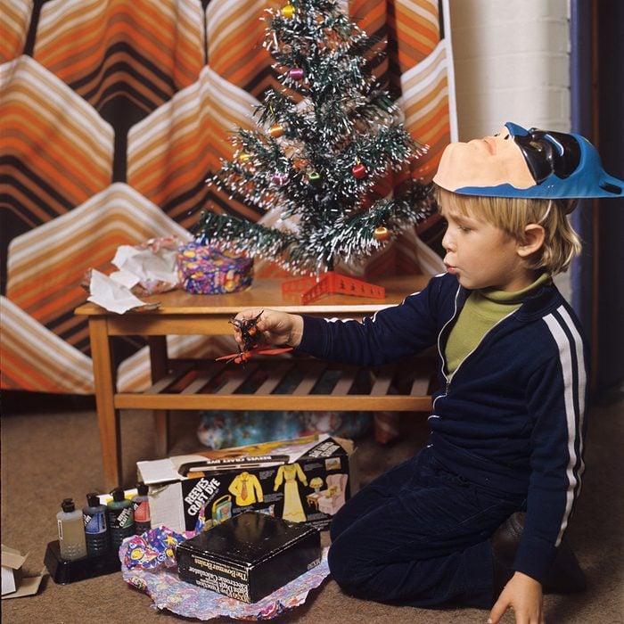 Young boy, Thomas Pietriangeli opening his Christmas presents Father and son opening Christmas presents