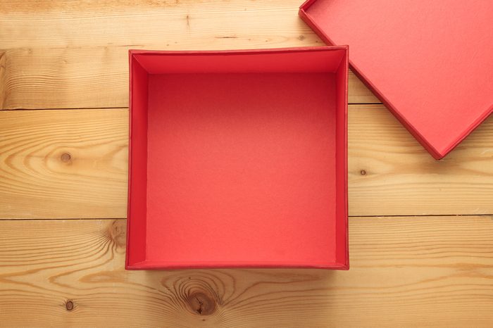 Empty gift box on a wooden background
