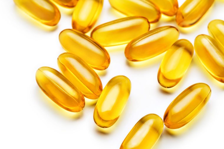 Close up of capsules Omega 3 on white background. Top view, high resolution product. Health care concept