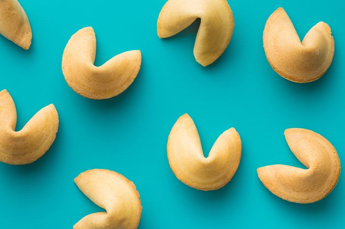 The fortune cookies on blue background. Top view.
