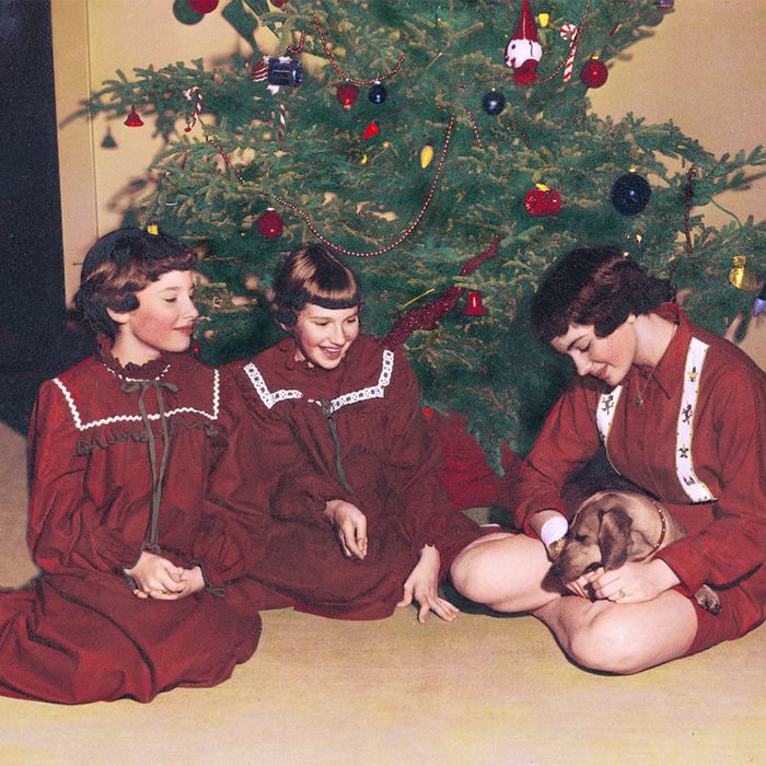 Three girls with a new puppy