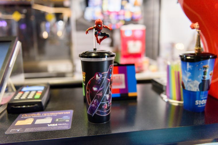 MINSK, BELARUS - MAY 3, 2018:Small figure of SpiderMan on a souvenir cup in the Galileo cinema on the launch day of the Marvel's film Avengers: Infinity War