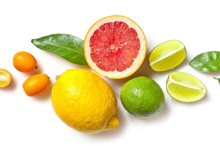 various citrus fruits isolated on white background, top view