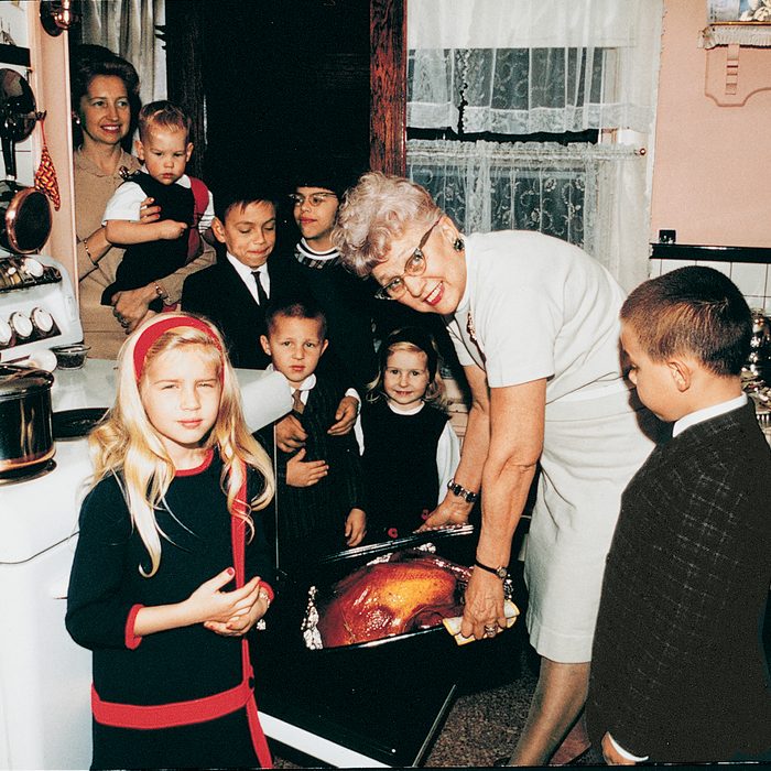 Family cooking turkey