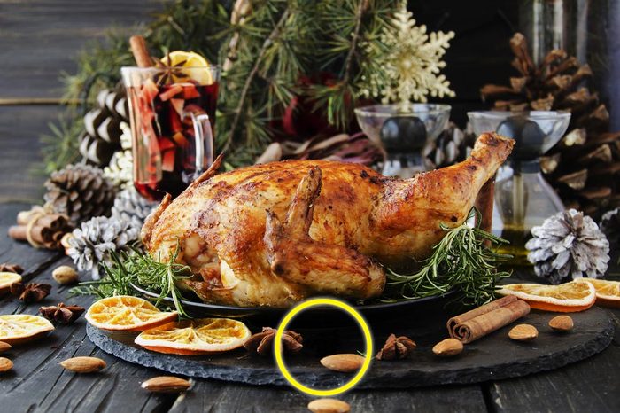 Roast chicken or turkey for Christmas and New Year with mulled wine and Christmas decorations, selective focus