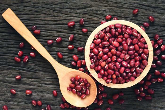 Red beans in wooden on wood background