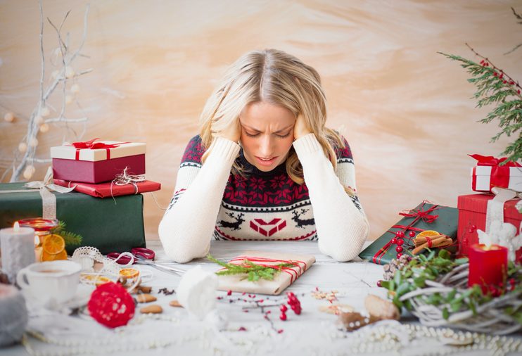 Woman depressed with Christmas gift clutter