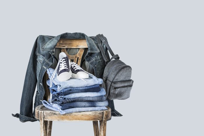 Stack of clothes on wooden chair