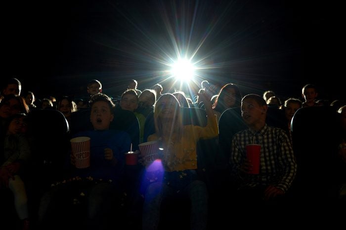 Shot of a dark cinema auditorium full of people enjoying watching a movie copyspace background humans many full darkness premiere film entertainment entertaining fun activity concept.