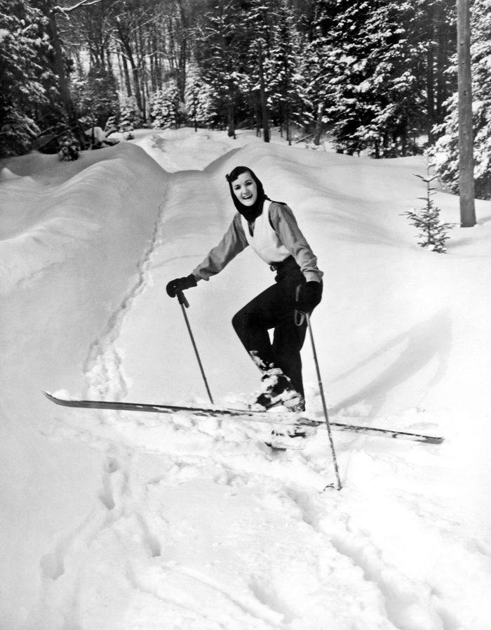 Mandatory Credit: Photo by Underwood Archives/UIG/Shutterstock (3837599a) Lake Of Bays, Ontario, Canada: c. 1956 A young woman turns in the cross country trail and smiles for the camera. VARIOUS