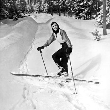 Mandatory Credit: Photo by Underwood Archives/UIG/Shutterstock (3837599a) Lake Of Bays, Ontario, Canada: c. 1956 A young woman turns in the cross country trail and smiles for the camera. VARIOUS