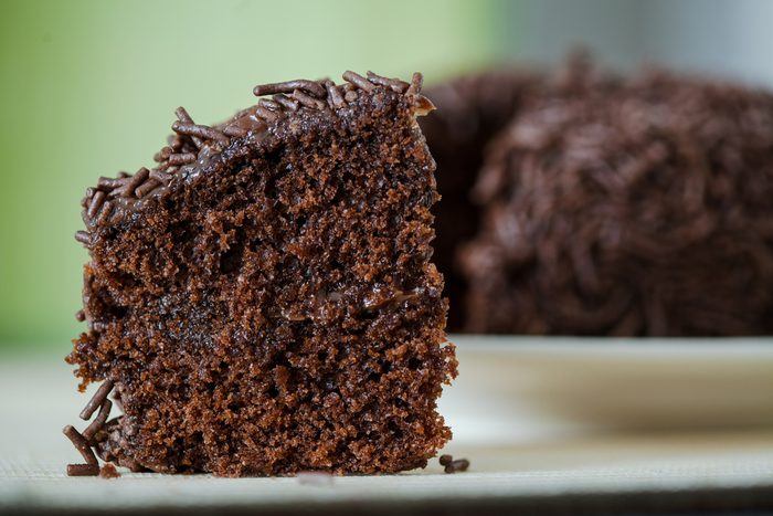 Chocolate cake with chocolate granules and cholate stuffing, macro details and front angle