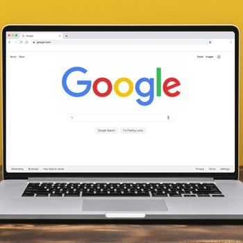 Google homepage on laptop in yellow room