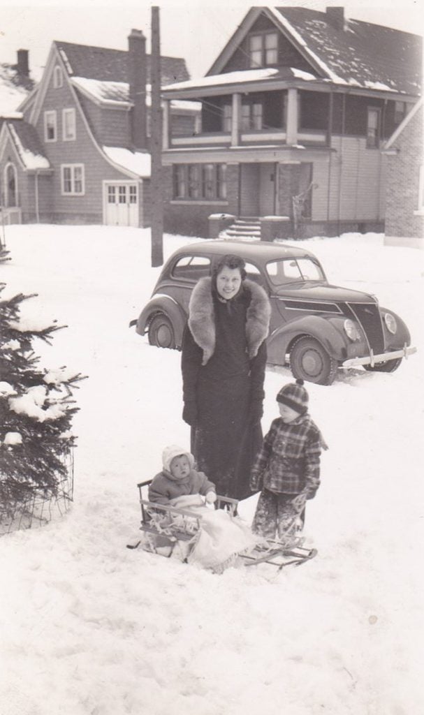 This is Mom; Wanda Wojcik; and my brother Roger and sister Audrey in front of the first family home in Niagara Falls; New York. It is winter 1938-39. Dad Bruno is the photographer and so is rarely in any of the family pictures.
