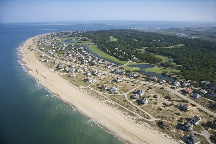 Aerial view of beach and residential neighborhood at Bald Head Island, North Carolina.
