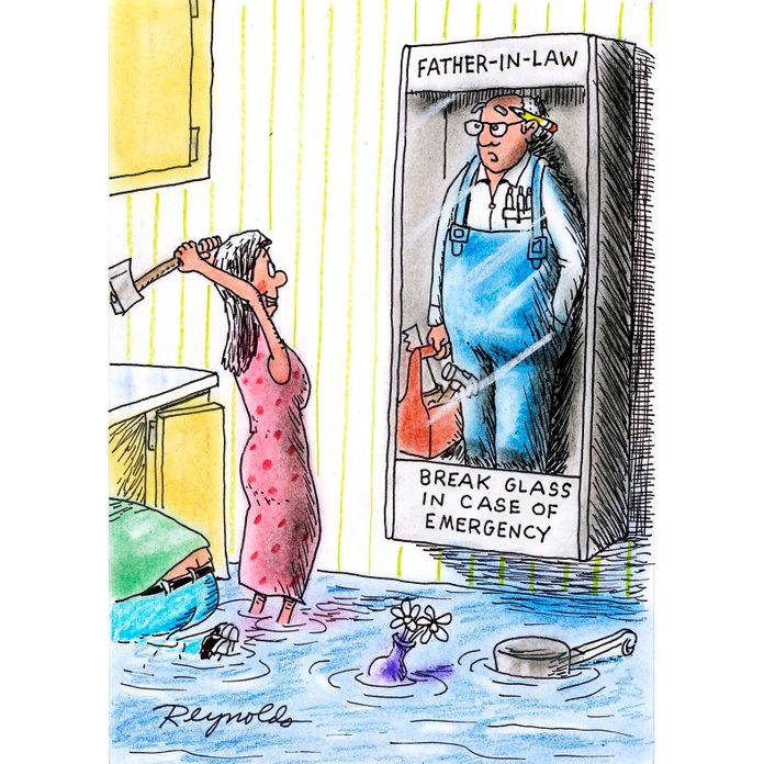 woman standing in a flooded bathroom about the break the glass of the Emergency Father-in-Law on the wall