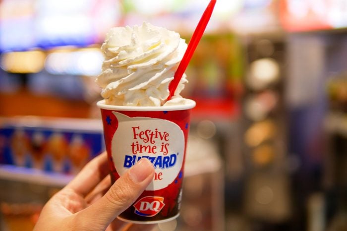 BANGKOK, THAILAND - DECEMBER 21, 2017: Dairy Queen at Siam Center branch in Bangkok, Thailand serve the blizzard ice cream caramel almond with whipped cream topping.