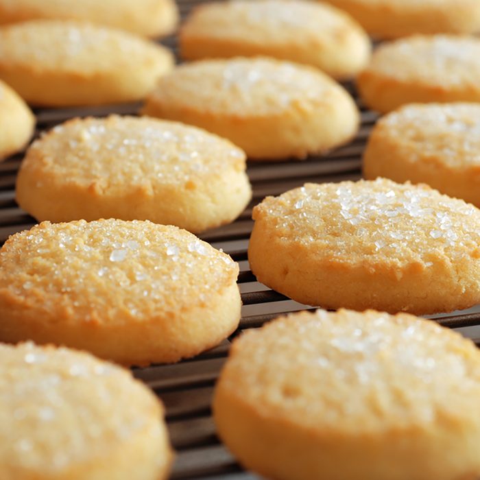 Freshly baked sugar cookies on cooling rack. Closeup with extremely shallow dof. ; Shutterstock ID 153370979; Job (TFH, TOH, RD, BNB, CWM, CM): Taste of Home
