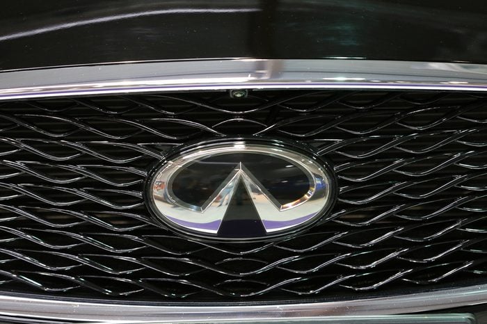 CRACOW, POLAND - MAY 21, 2016: Infiniti metallic logo closeup on the Infiniti car displayed at 3rd edition of MOTO SHOW in Cracow Poland.