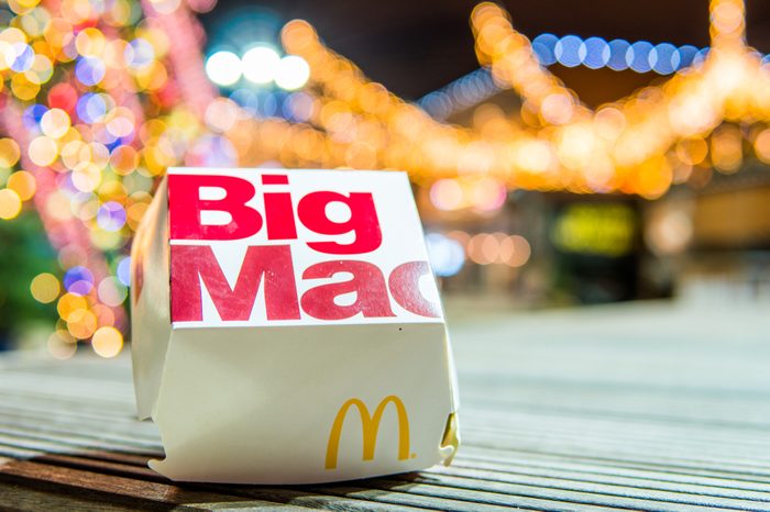 Lodz, Poland, January 5, 2018 McDonald's Big Mac night, Christmas tree in background, McDonald's was founded in 1940 as restaurant operated by Richard and Maurice McDonald, in USA