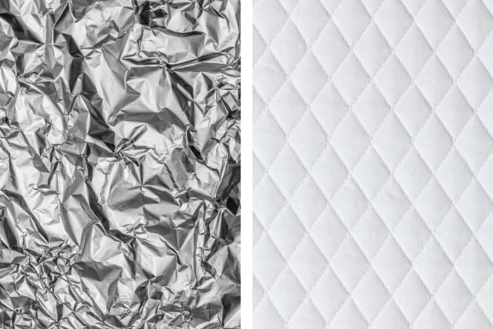 Aluminum foil texture next to white mattress