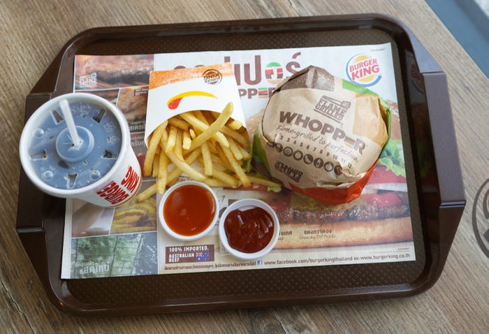 Nakhon Pathom, Thailand - May 10, 2018 : Burger King Cola Cup, Potato french fries and Whopper Hamburger in Burger King restaurant. Burger King is a global chain of hamburger fast food restaurants