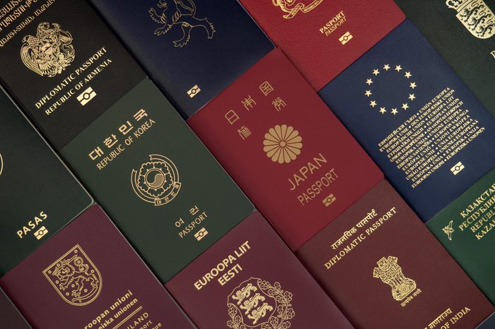 Different foreign passports from many countries by the world as colorful background