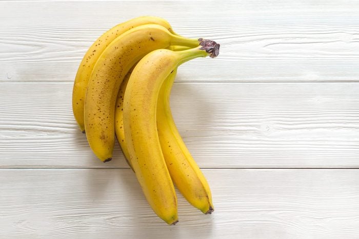 close-up of bananas on white wooden boards